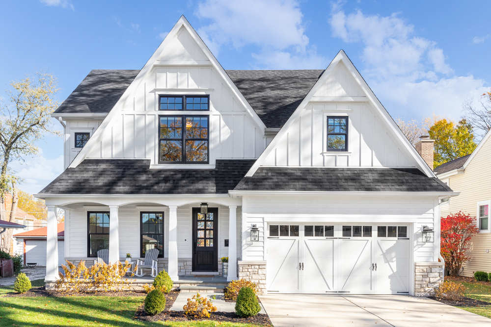 White home with black exterior window frames